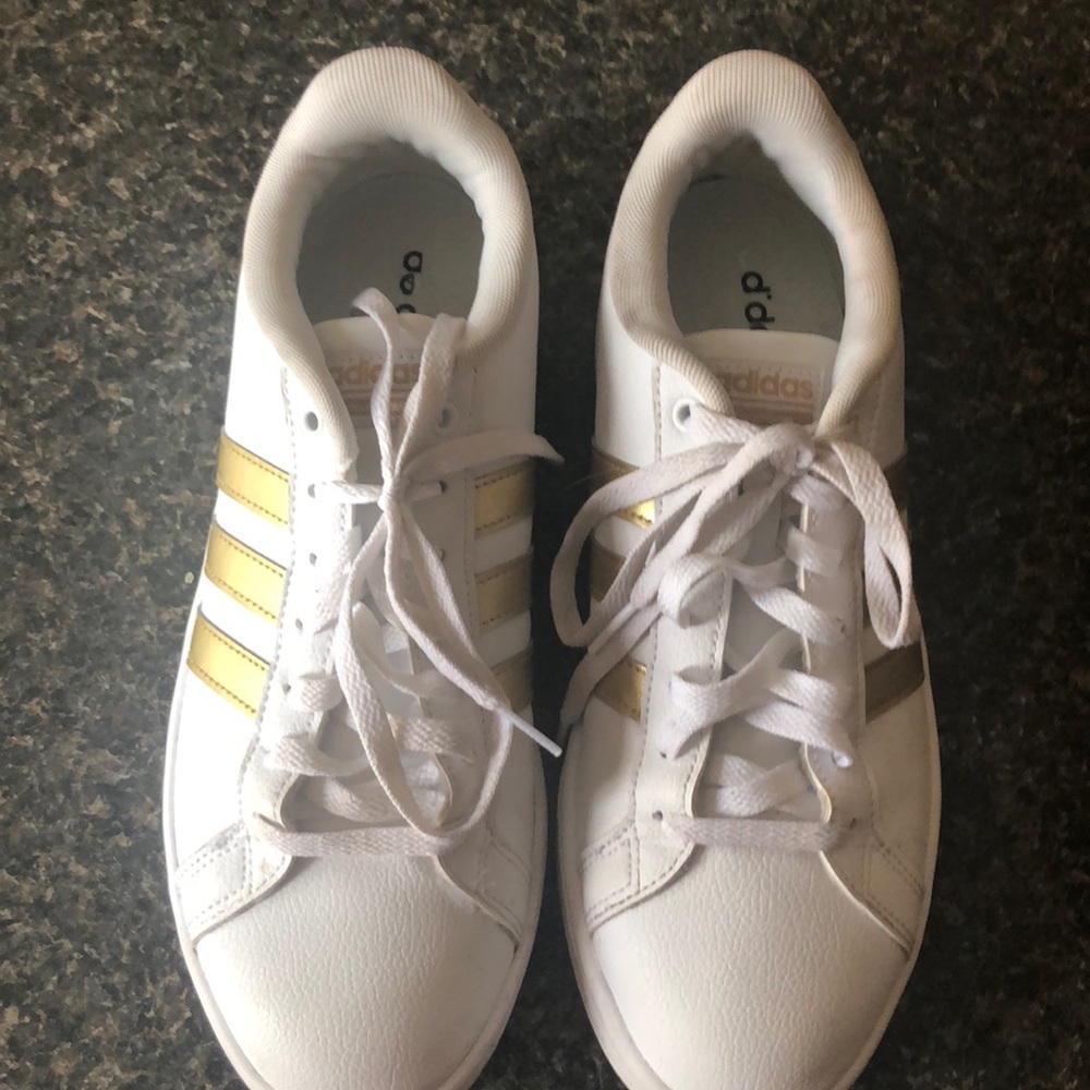 These are gold and white adidas